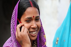 Woman listening to a Kilkari audio message