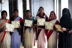 health workers holding Mobile Academy completion certificate